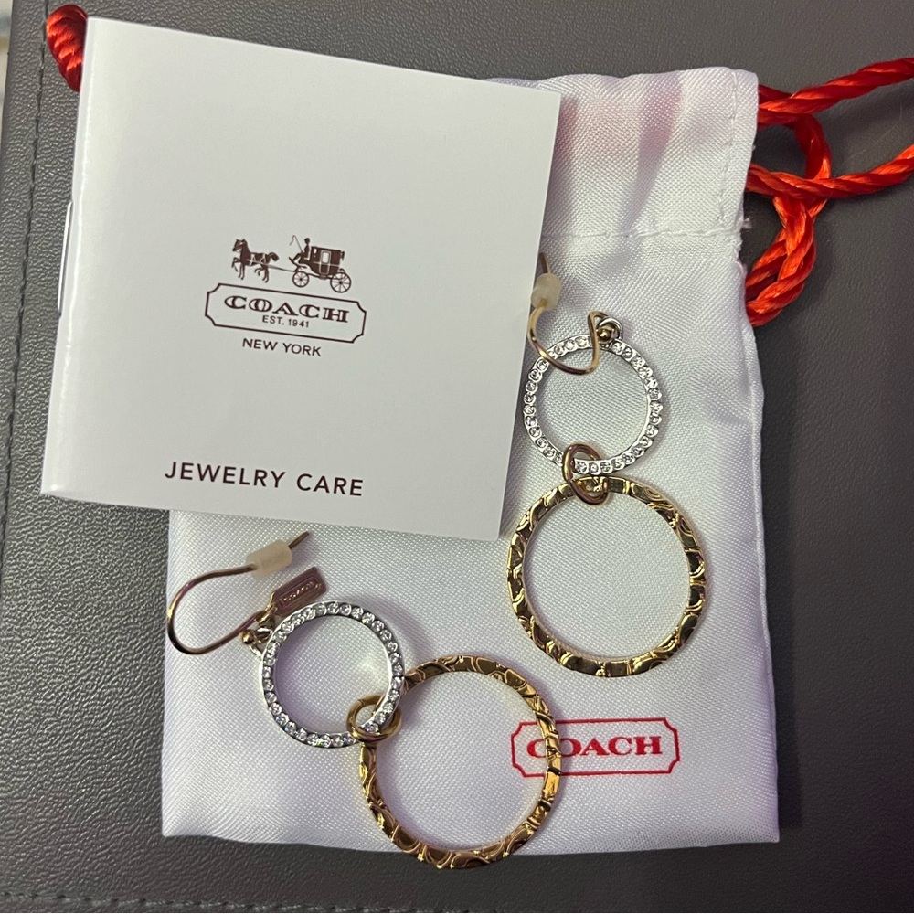 Gold Coach earrings